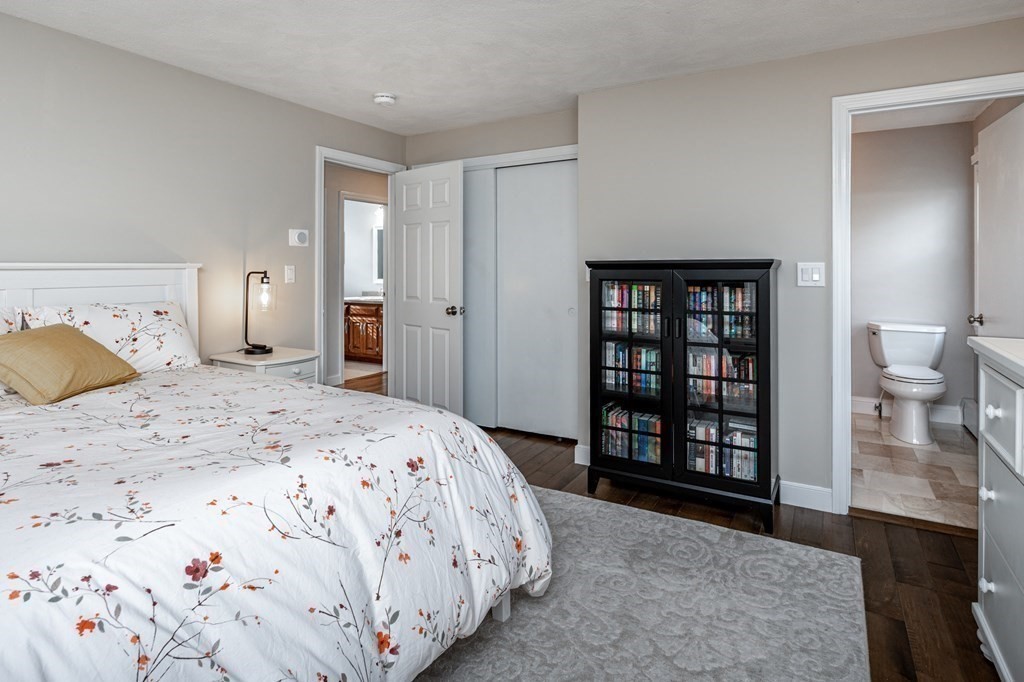119 Gayland Road Needham, MA 02492 - Photo 31 of 42 a bedroom with a large bed and a couch