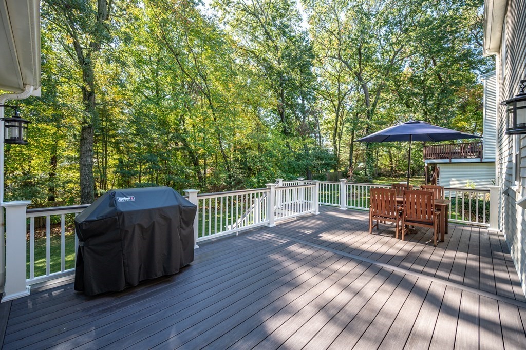 119 Gayland Road Needham, MA 02492 - Photo 33 of 42 a view of a roof deck with chair and wooden floor