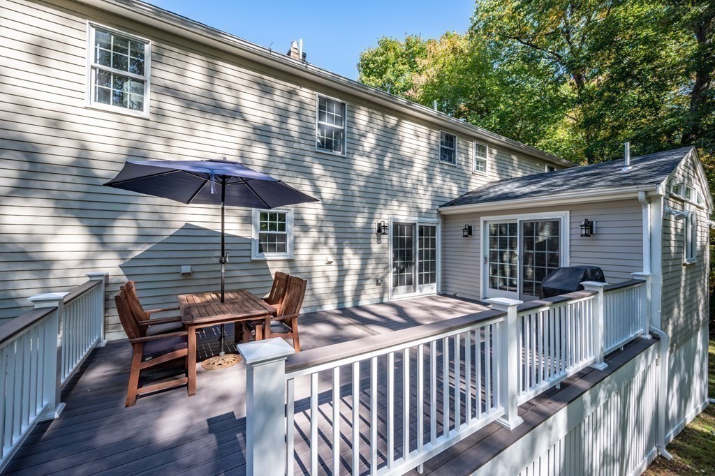 119 Gayland Road Needham, MA 02492 - Photo 34 of 42 a view of a roof deck with wooden chairs and wooden fence