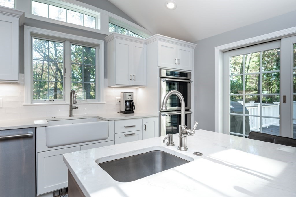 119 Gayland Road Needham, MA 02492 - Photo 6 of 42 a kitchen with a sink a stove and a microwave