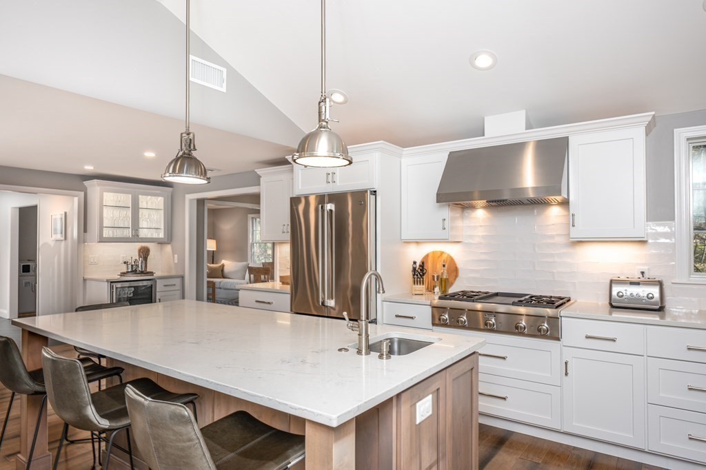 119 Gayland Road Needham, MA 02492 - Photo 8 of 42 a kitchen with stainless steel appliances a sink a stove and chairs