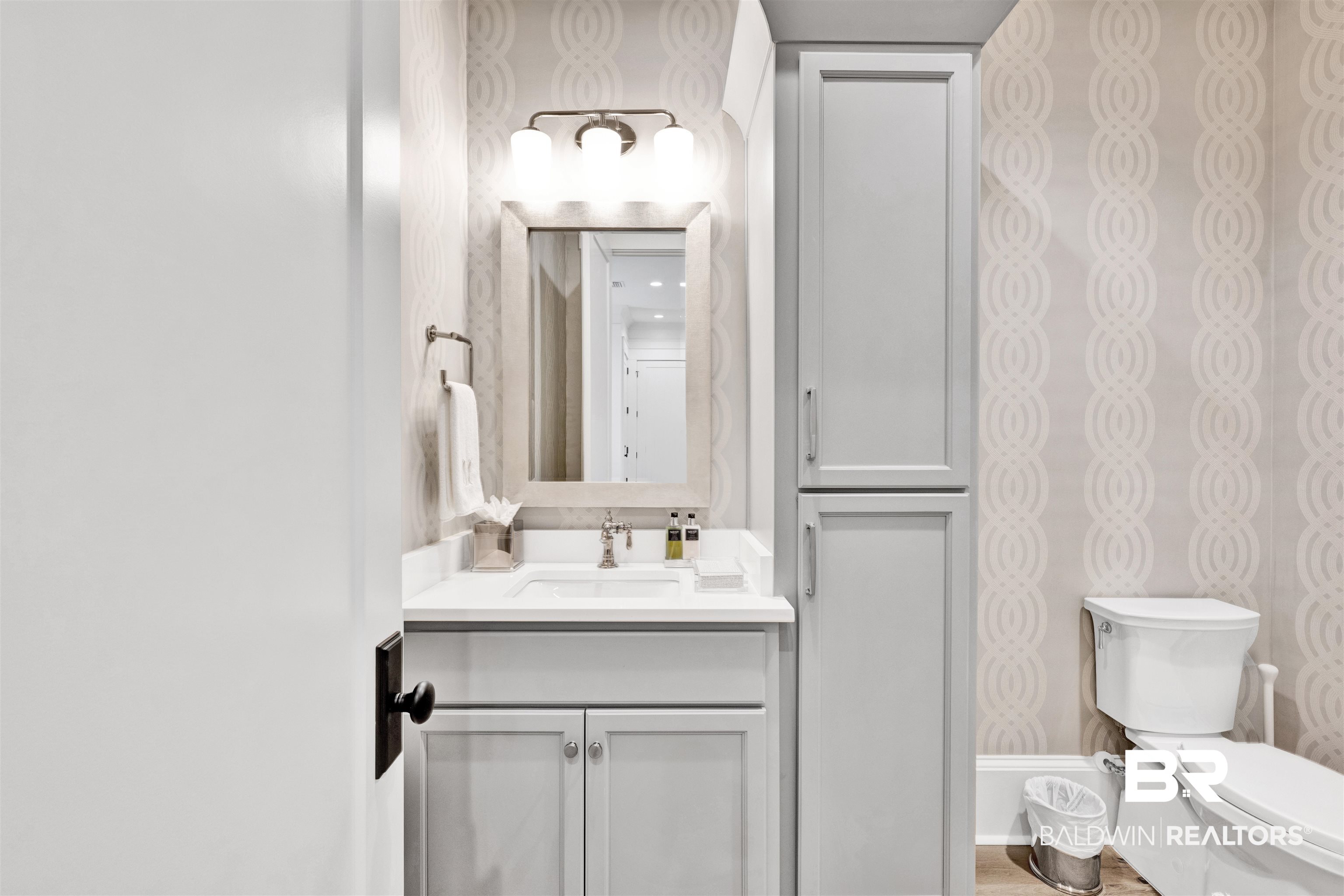 861 Inlet Circle Gulf Shores, AL 36542 - Photo 17 of 54 Bathroom featuring vanity and wallpapered walls