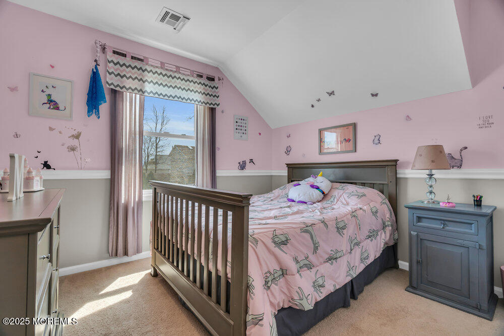 108 Maple Place Keyport, NJ 07735 - Photo 20 of 26 a bedroom with a bed and a window