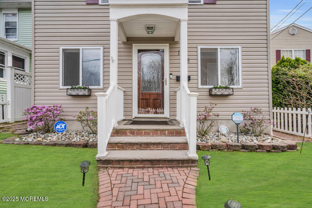 108 Maple Place Keyport, NJ 07735 - Photo 2 of 26 a front view of a house with garden