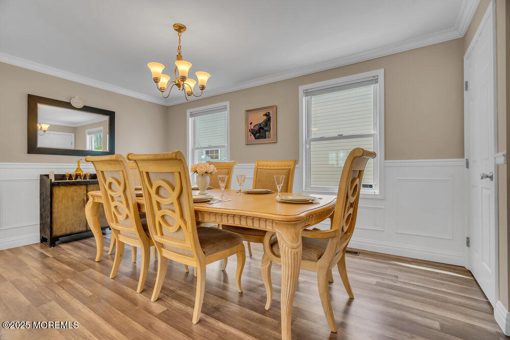 108 Maple Place Keyport, NJ 07735 - Photo 9 of 26 a view of a dining room with furniture and wooden floor