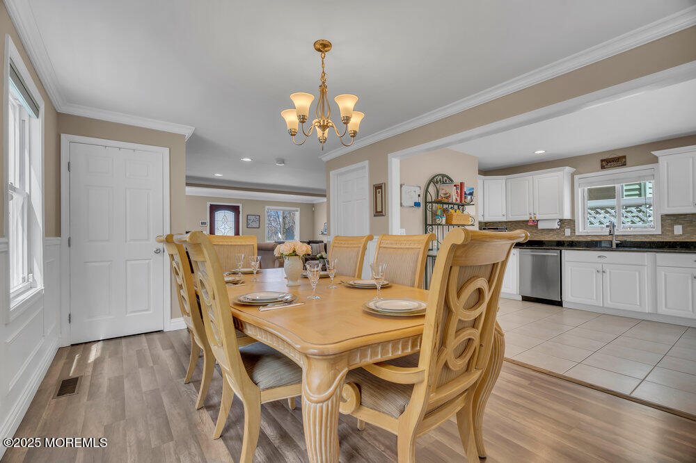 108 Maple Place Keyport, NJ 07735 - Photo 10 of 26 a view of a dining room with furniture and wooden floor