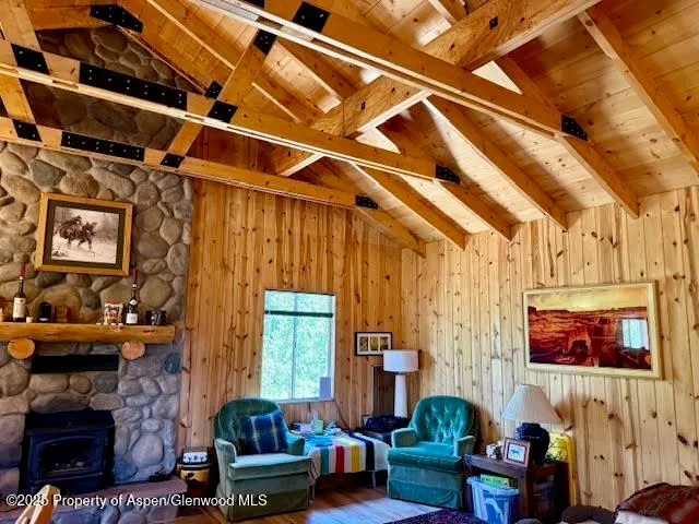 a view of a house with backyard sitting area and garden