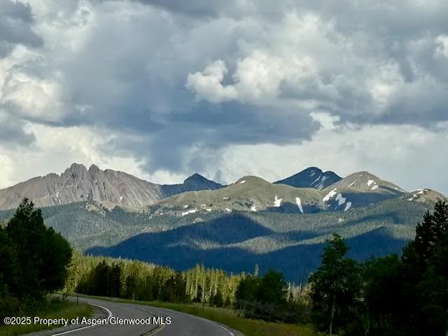 a kitchen with a sink appliances and cabinets