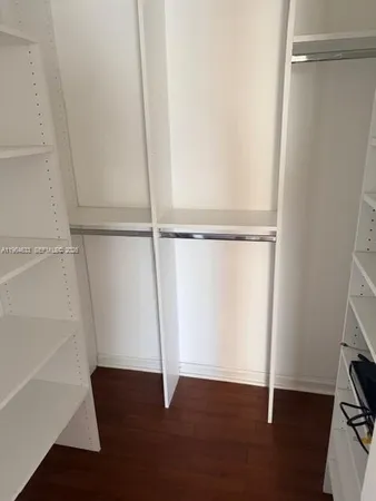 a view of an empty walk in closet