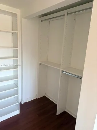 a bathroom with a granite countertop shower a toilet and a sink