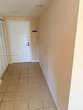 a view of hallway with door
