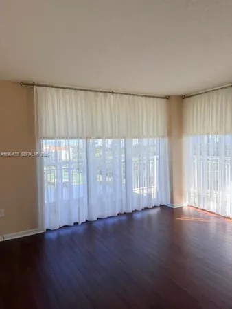 a bathroom with a toilet and shower