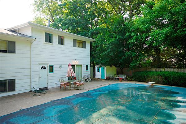 93 Woodcliff Road Brookline, MA 02467 - Photo 12 of 12 a view of a chair and table in backyard of the house