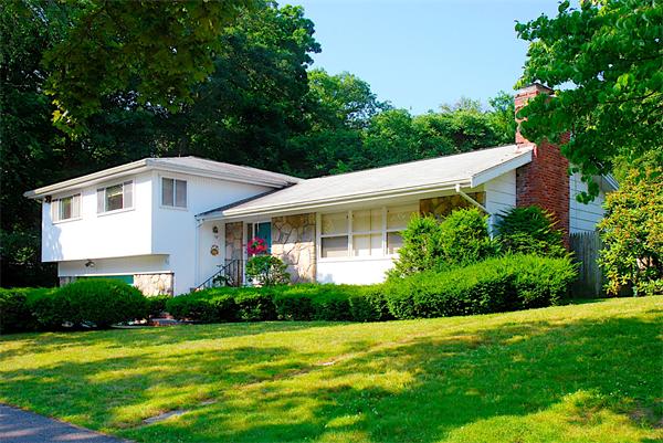 93 Woodcliff Road Brookline, MA 02467 - Photo 3 of 12 a front view of a house with a yard