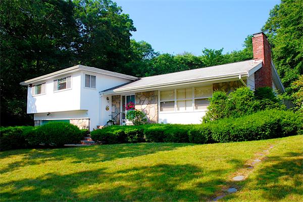 93 Woodcliff Road Brookline, MA 02467 - Photo 4 of 12 a front view of a house with garden