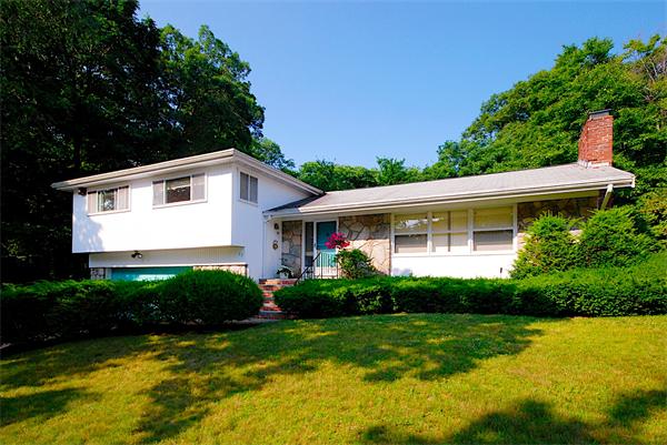 93 Woodcliff Road Brookline, MA 02467 - Photo 5 of 12 a front view of house with yard and green space