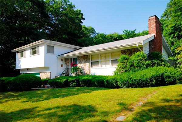 93 Woodcliff Road Brookline, MA 02467 - Photo 6 of 12 a front view of a house with a yard