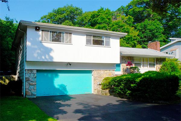 93 Woodcliff Road Brookline, MA 02467 - Photo 9 of 12 a front view of a house with garden