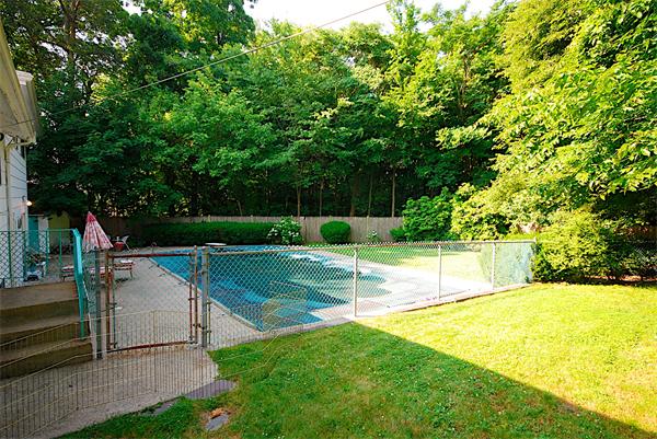 93 Woodcliff Road Brookline, MA 02467 - Photo 10 of 12 a view of a backyard with swimming pool