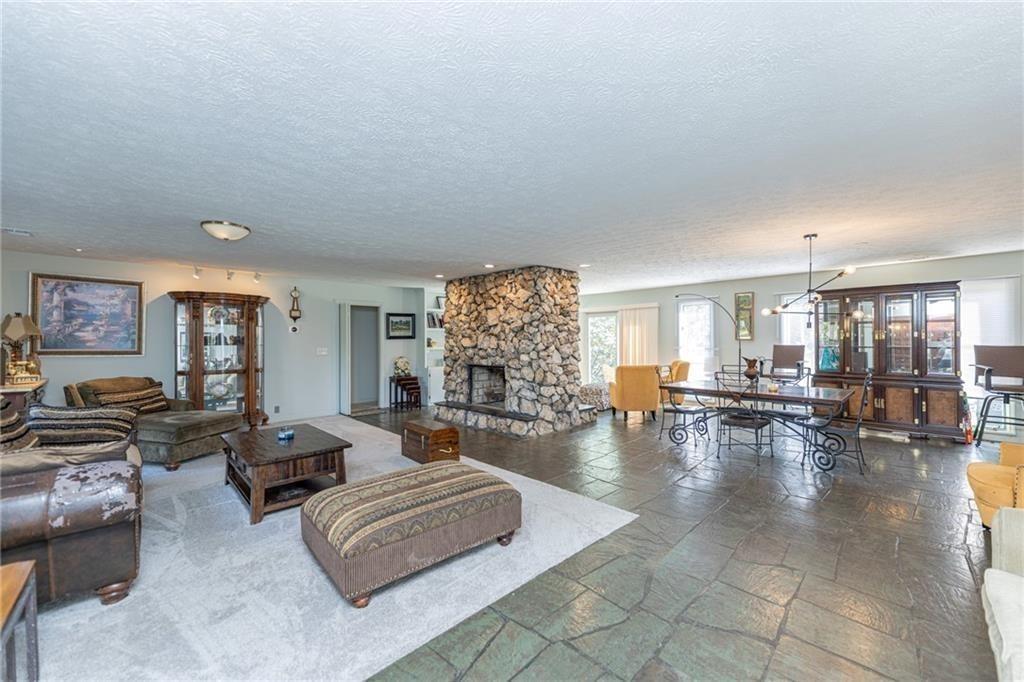 225 Banks Road Fayetteville, GA 30214 - Photo 11 of 26 a living room with fireplace furniture and wooden floor
