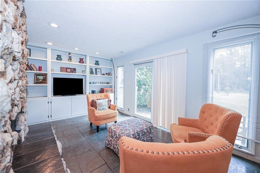 225 Banks Road Fayetteville, GA 30214 - Photo 14 of 26 a living room with furniture and a fireplace