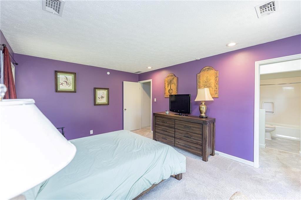 225 Banks Road Fayetteville, GA 30214 - Photo 18 of 26 a bedroom with a bed and a dresser