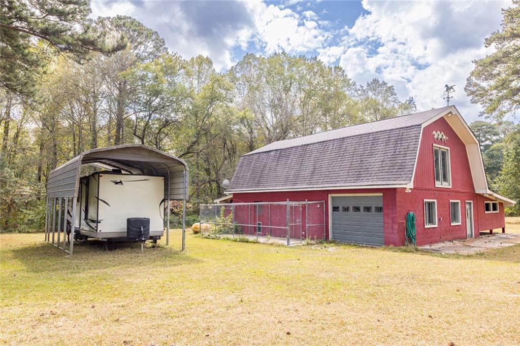 225 Banks Road Fayetteville, GA 30214 - Photo 5 of 26 a front view of a house with a yard