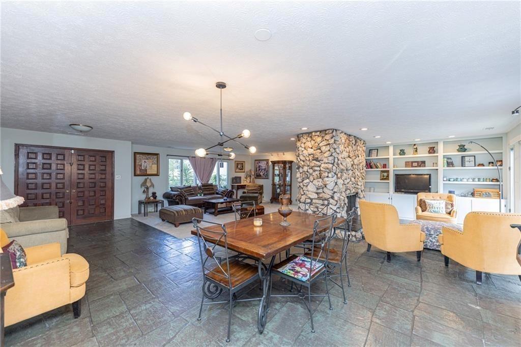 225 Banks Road Fayetteville, GA 30214 - Photo 10 of 26 a living room with fireplace furniture and a chandelier
