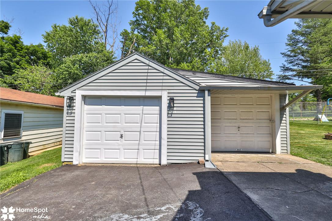 415 Willow Road Hellertown, PA 18055 - Photo 4 of 25 A spacious detached two-car garage offers ample parking and storage, complementing the property's exterior.