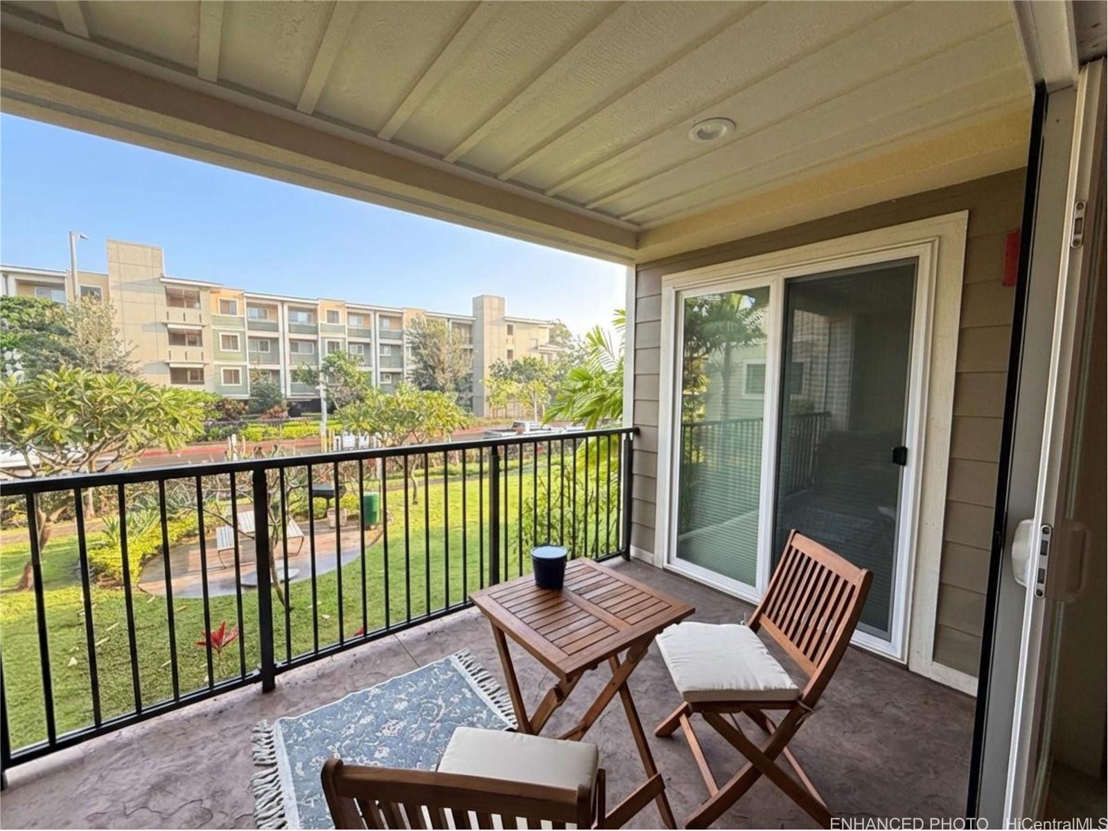 409 Kailua Road, Unit 7106 Kailua, HI 96734 - Photo 17 of 22 Enhanced - Lanai accessible through living room and primary bedroom. Views of courtyard, Aoloa Street, & Building 6.