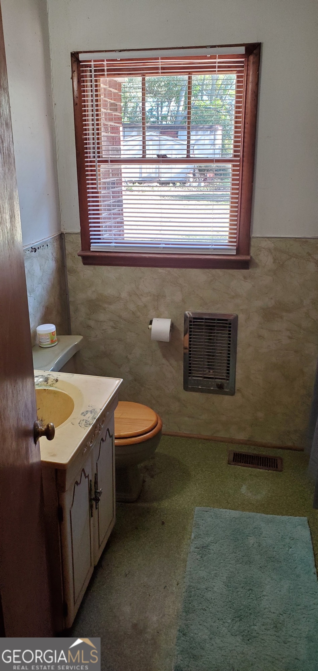 1061 Burger Road Watkinsville, GA 30677 - Photo 10 of 43 a bathroom with a granite countertop sink a toilet and a mirror