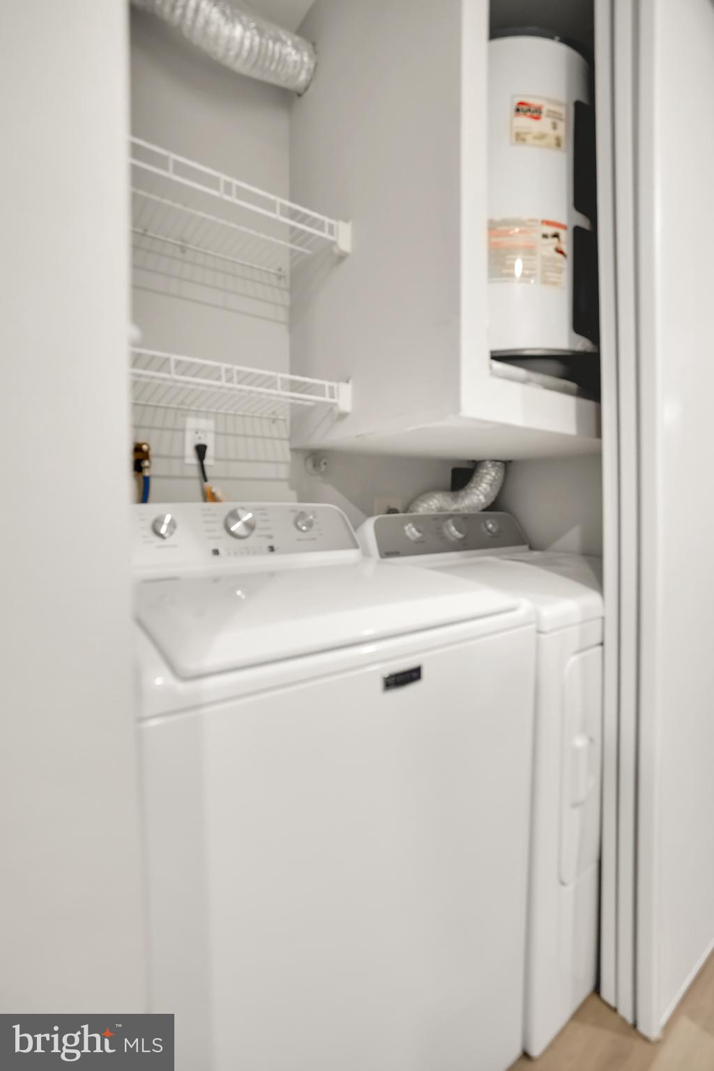 15121 Glade Drive, Unit 132F Silver Spring, MD 20906 - Photo 19 of 27 a utility room with dryer and washer