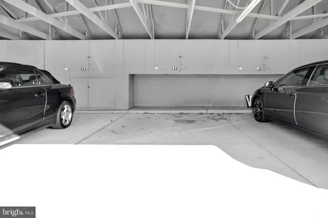 a view of a kitchen with a refrigerator and a sink