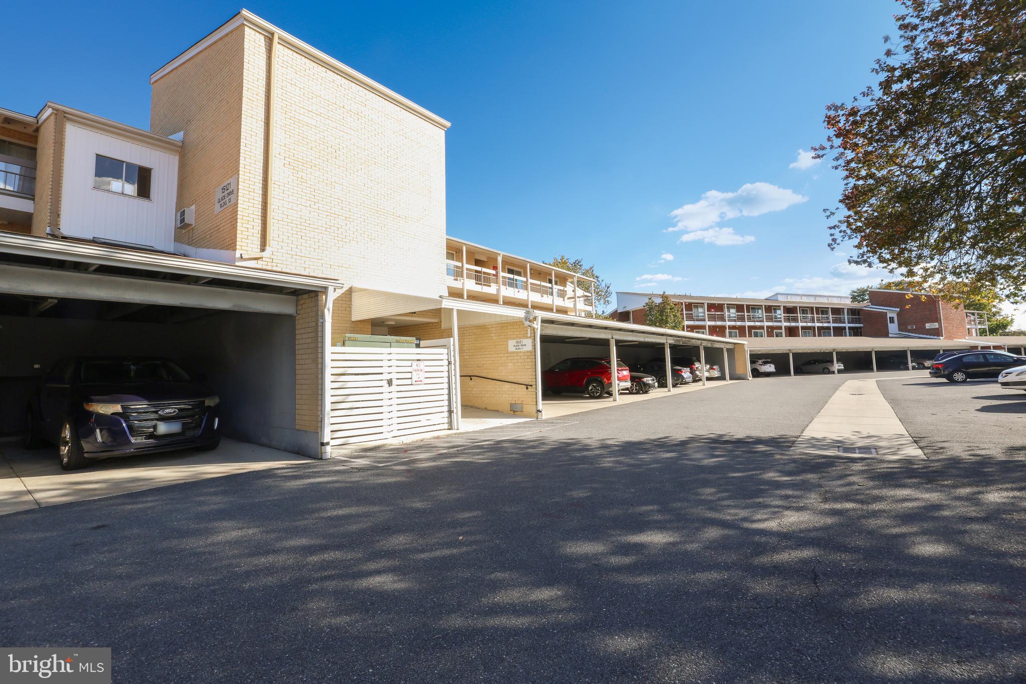 15121 Glade Drive, Unit 132F Silver Spring, MD 20906 - Photo 23 of 27 a view of a house with a car park