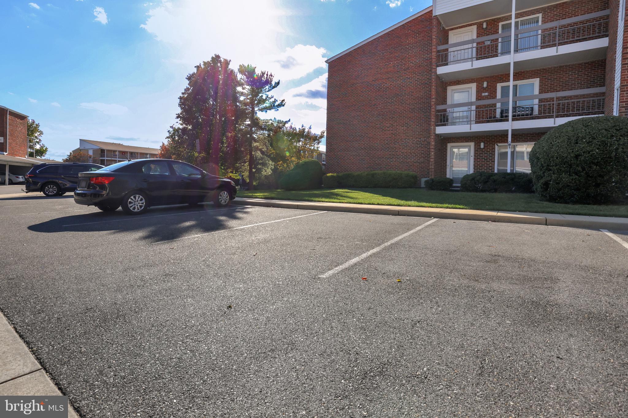 15121 Glade Drive, Unit 132F Silver Spring, MD 20906 - Photo 24 of 27 a view of a building with a yard