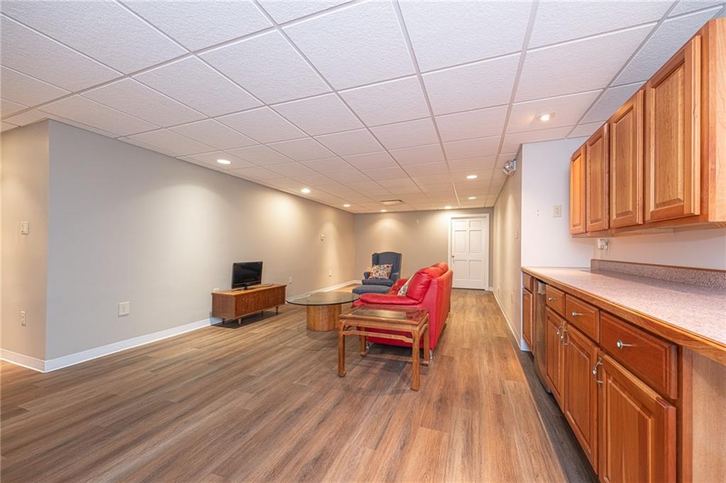 840 Old Millcreek Road Hookstown, PA 15050 - Photo 23 of 33 a living room with a sink and wooden floor
