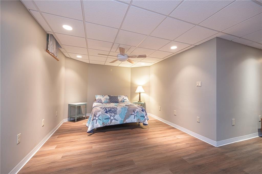 840 Old Millcreek Road Hookstown, PA 15050 - Photo 25 of 33 a spacious bedroom with a bed and a chandelier