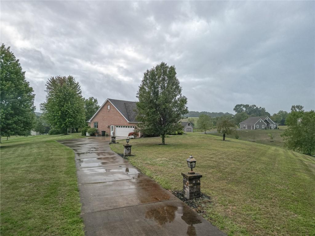 840 Old Millcreek Road Hookstown, PA 15050 - Photo 3 of 33 a backyard of a house with table and chairs