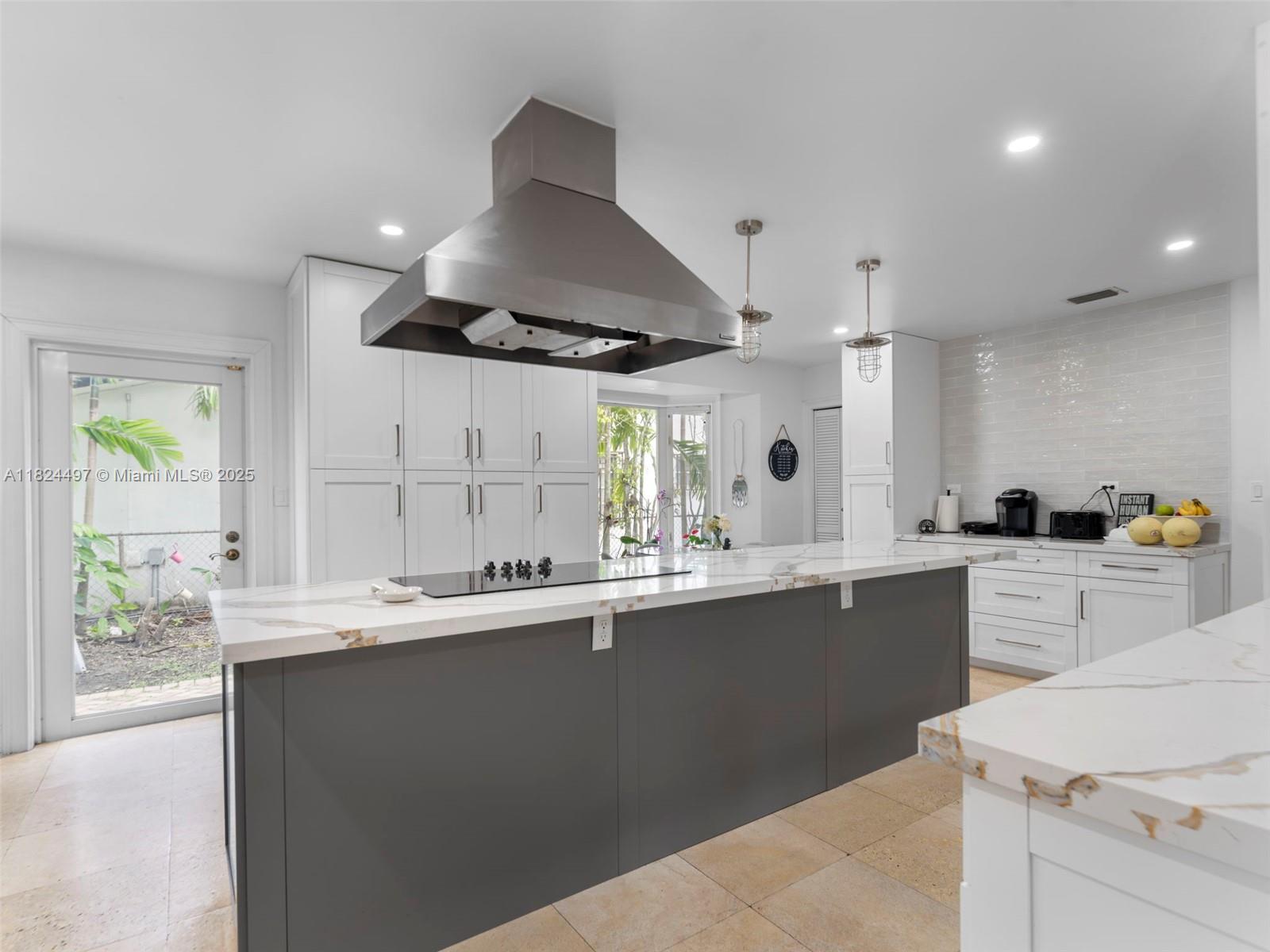 1851 Southwest 126th Court Miami, FL 33175 - Photo 11 of 85 a kitchen with stainless steel appliances a sink a stove a refrigerator and white cabinets
