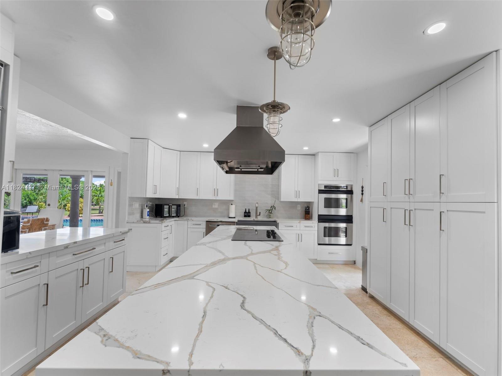 1851 Southwest 126th Court Miami, FL 33175 - Photo 17 of 85 a kitchen with stainless steel appliances granite countertop a refrigerator a sink dishwasher a stove and white cabinets with wooden floor