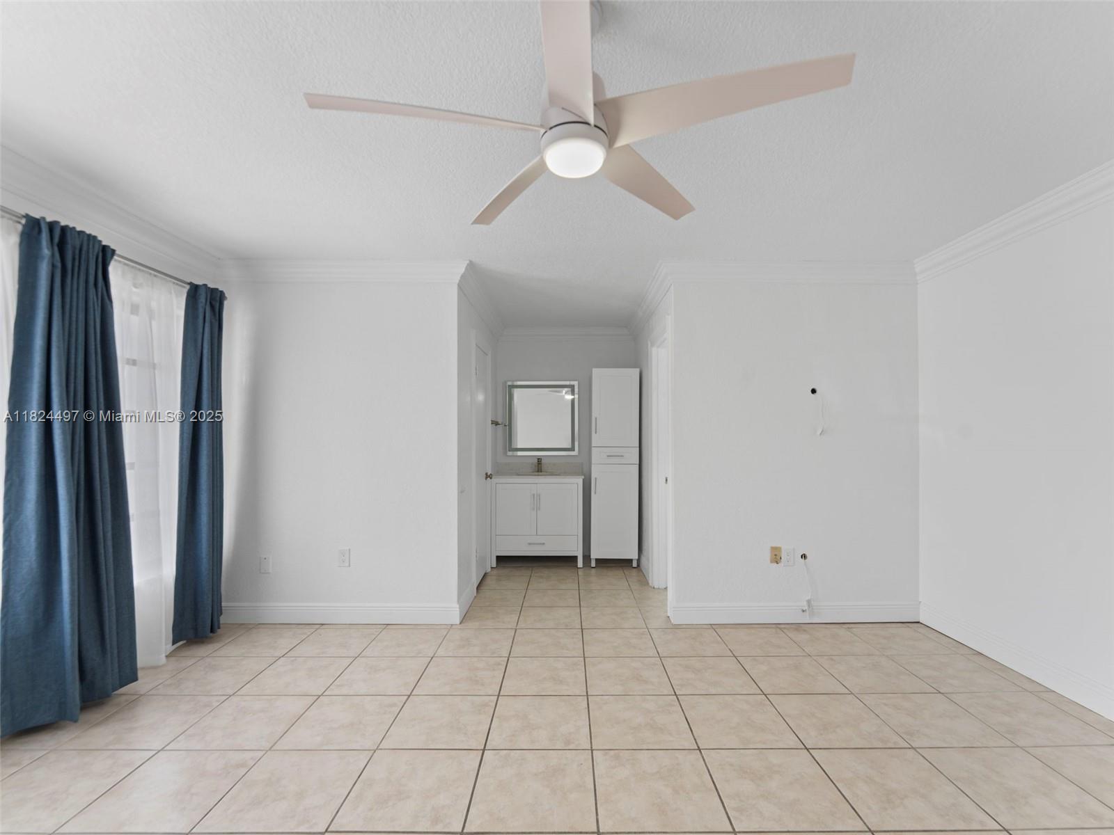 1851 Southwest 126th Court Miami, FL 33175 - Photo 45 of 85 an empty room with a bathroom and a mirror