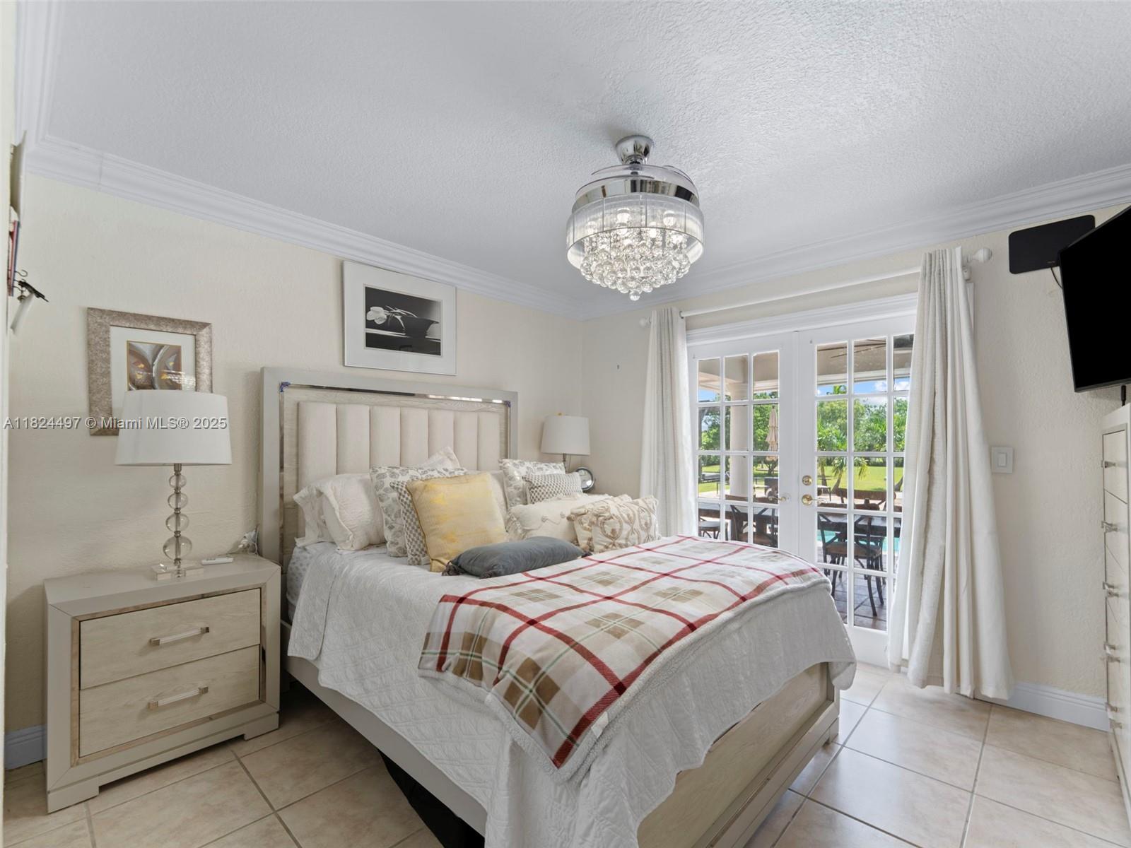 1851 Southwest 126th Court Miami, FL 33175 - Photo 55 of 85 a bedroom with a large bed and a window