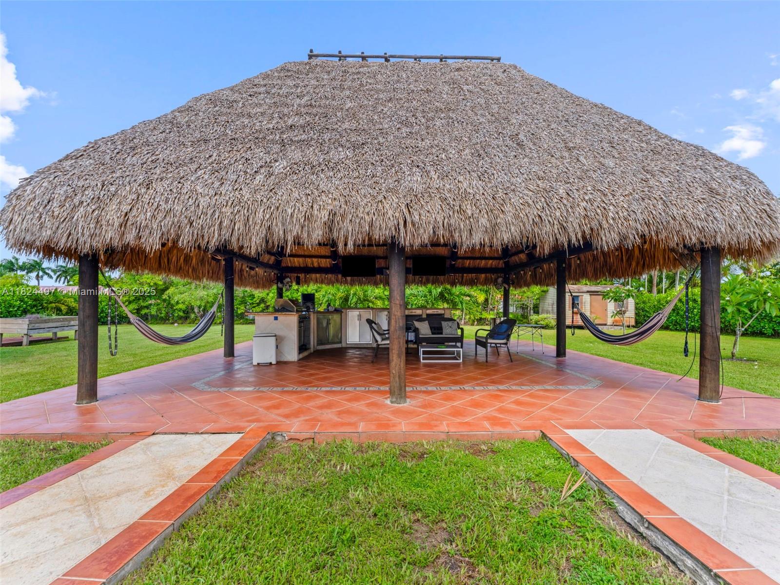 1851 Southwest 126th Court Miami, FL 33175 - Photo 72 of 85 a view of a patio with a table chairs and a patio
