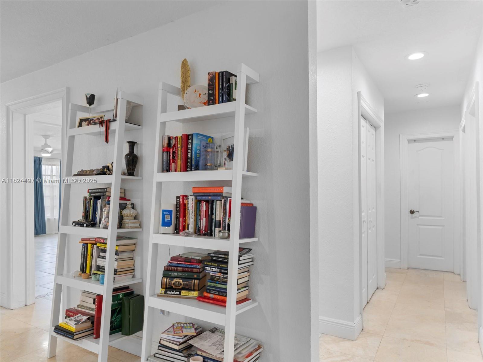1851 Southwest 126th Court Miami, FL 33175 - Photo 9 of 85 a room with a book shelf and a book shelf