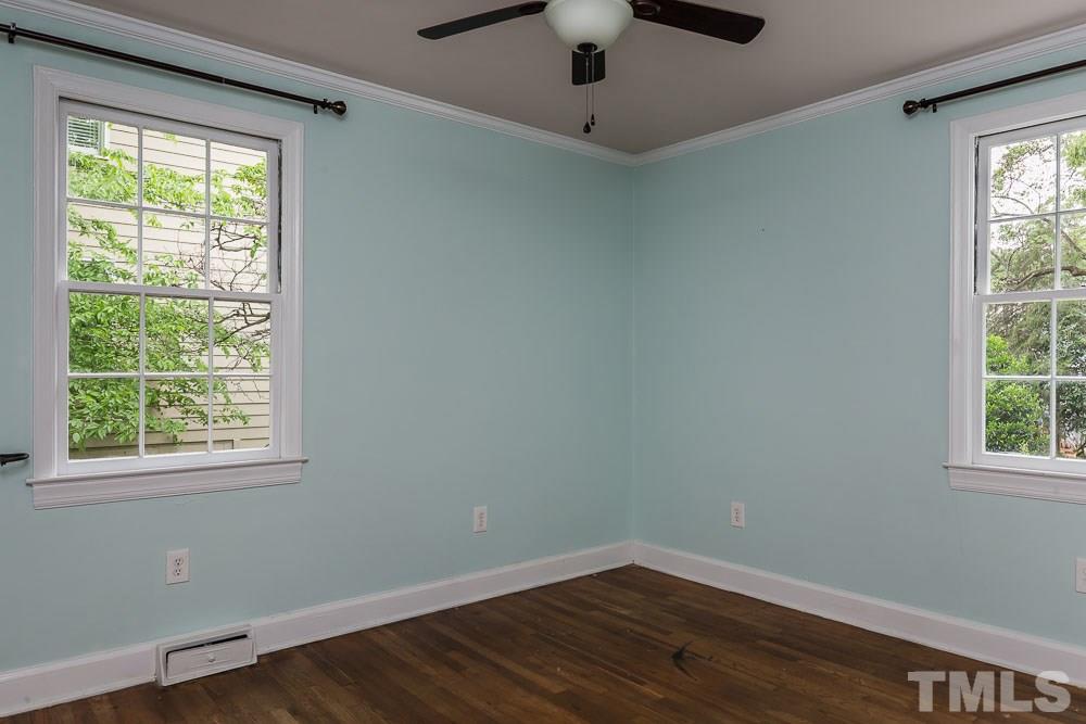 2113 Pine Drive Raleigh, NC 27608 - Photo 15 of 25 an empty room with wooden floor and windows