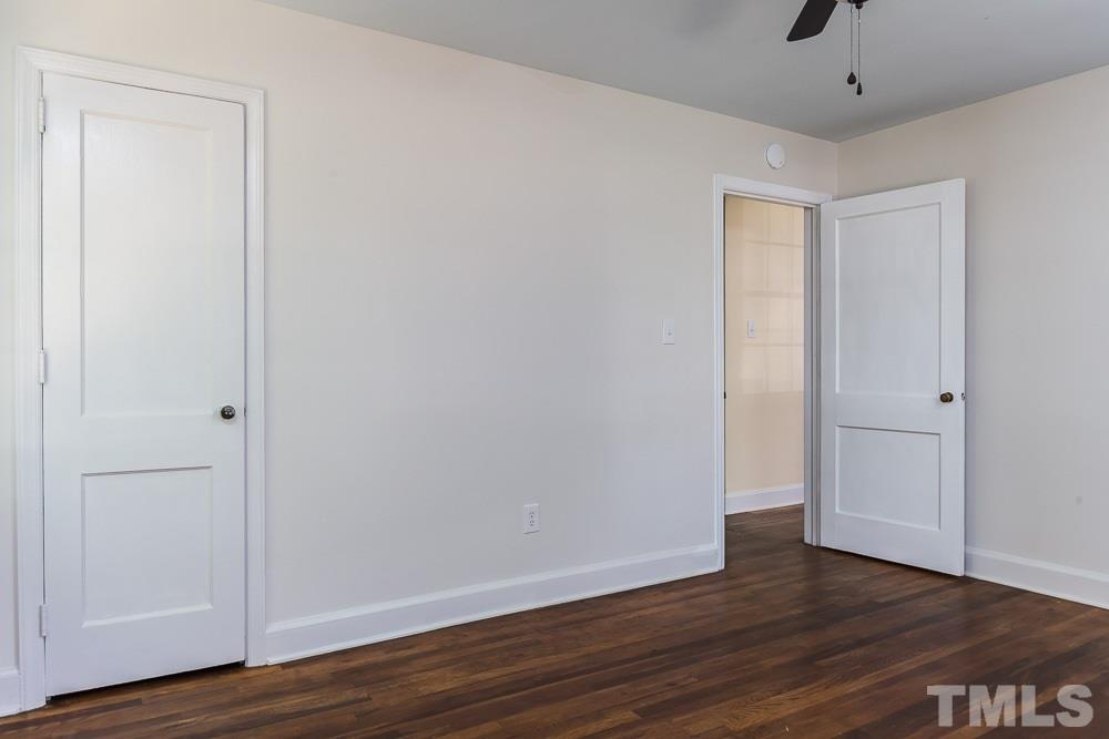 2113 Pine Drive Raleigh, NC 27608 - Photo 19 of 25 a view of an empty room with wooden floor