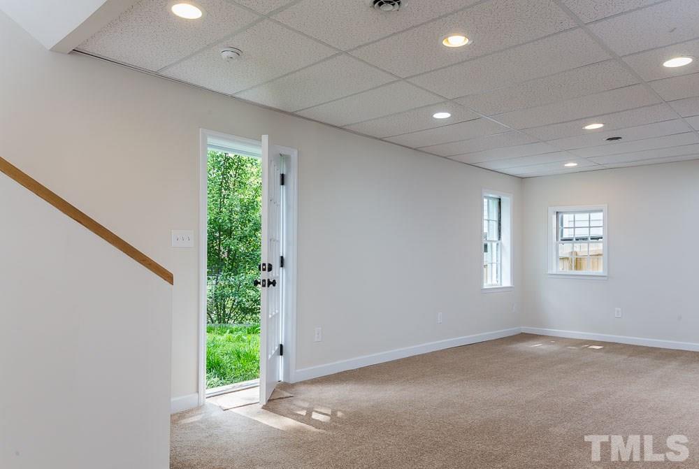 2113 Pine Drive Raleigh, NC 27608 - Photo 20 of 25 a view of an empty room with a window