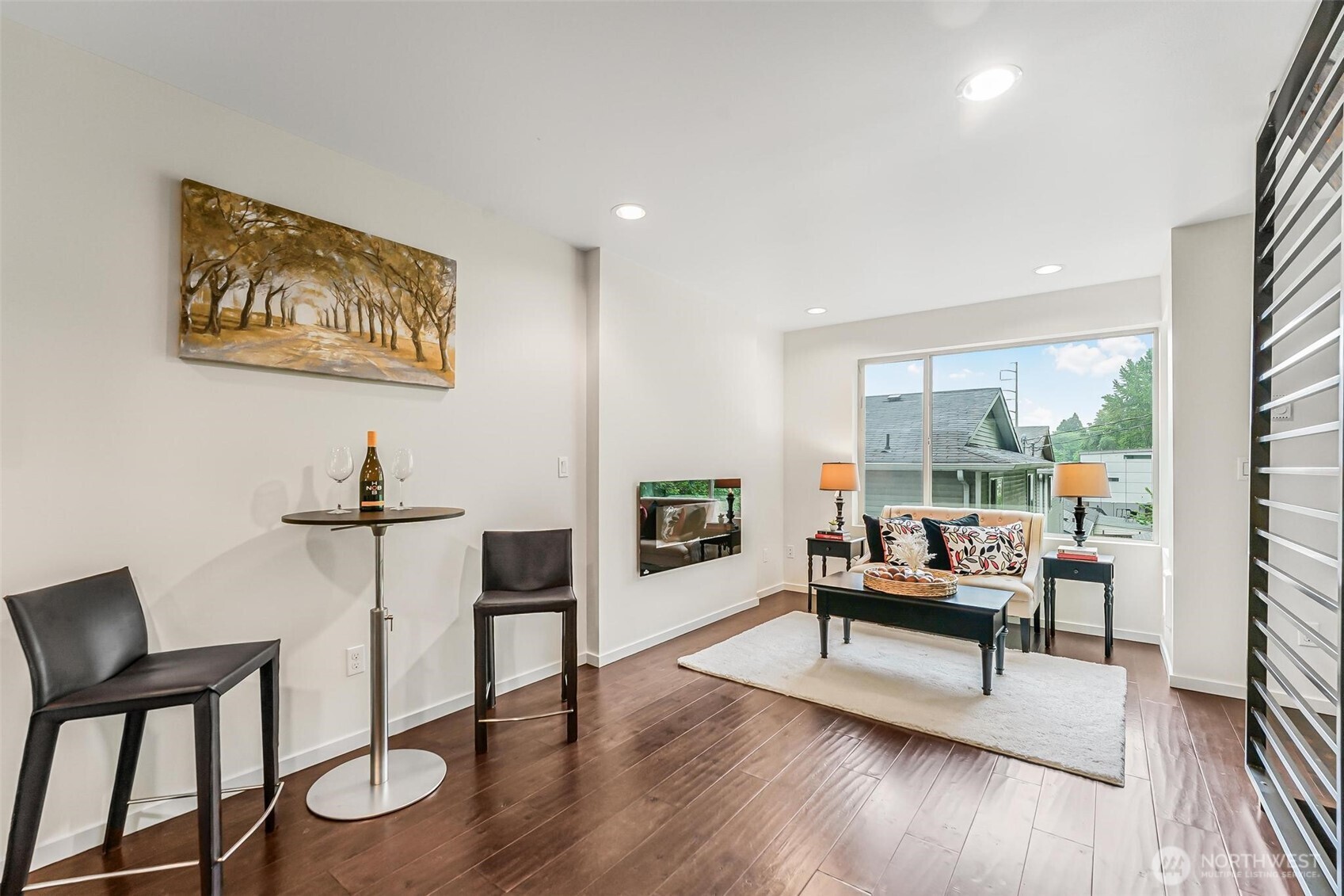 7748 Delridge Way Southwest Seattle, WA 98106 - Photo 1 of 22 a living room with furniture a fireplace and a floor to ceiling window
