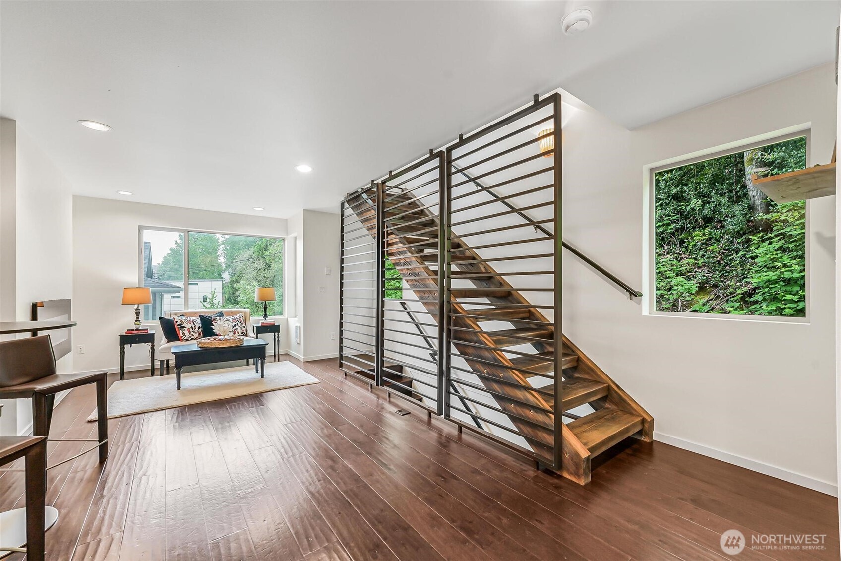 7748 Delridge Way Southwest Seattle, WA 98106 - Photo 11 of 22 a living room with furniture and a wooden floor