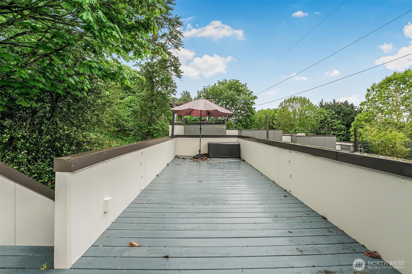 7748 Delridge Way Southwest Seattle, WA 98106 - Photo 20 of 22 a balcony with wooden floor and an outdoor space